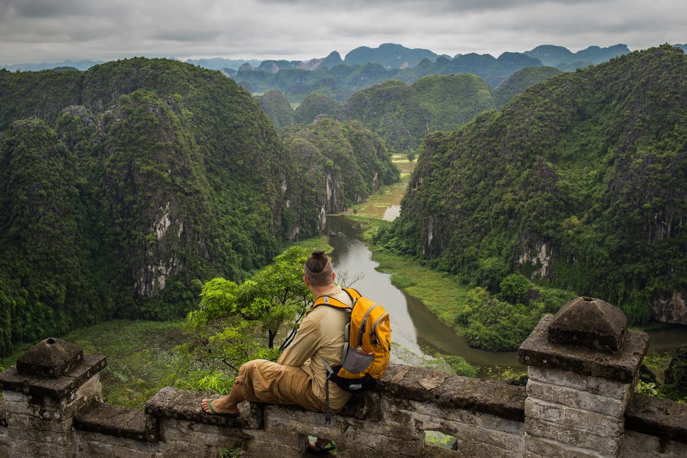 Solo traveler on top of Ha Long Bay in Vietnam