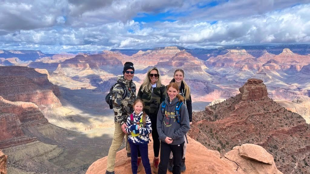 family of hikers female and male on a trip to Grand Canyon National Park