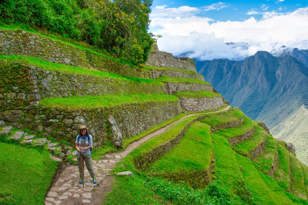 Asia trekker walk in Inca trail to Machu Picchu, Cusco - Peru