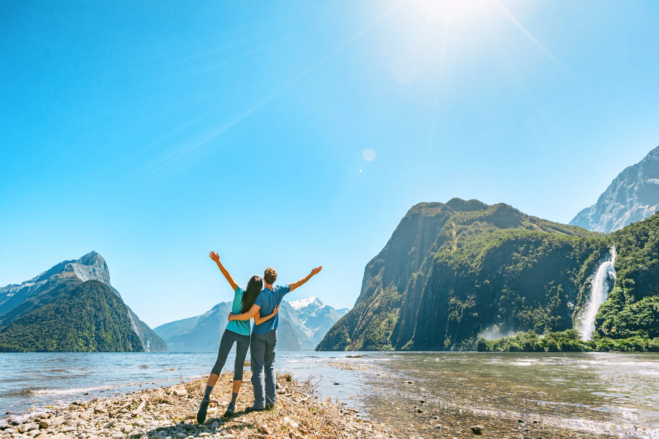 a couple female and male enjoying lakeside views of Fiordland in South Island of New Zealand, Europe