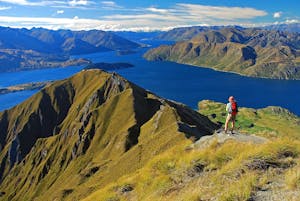 Solo hiker on the Wanaka Lake trail in New Zealand, Europe