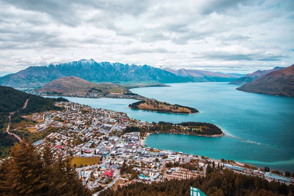 aerial view of all of Queenstown, New Zealand, surrounded by the Southern Alps