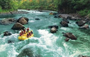 groups of rafters rafting in whitewater rapids of Pacuare River in Costa Rica, South America