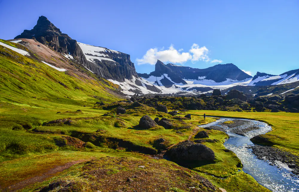 solo hiker on a expedition to see Iceland's Eastern Fjords in Europe