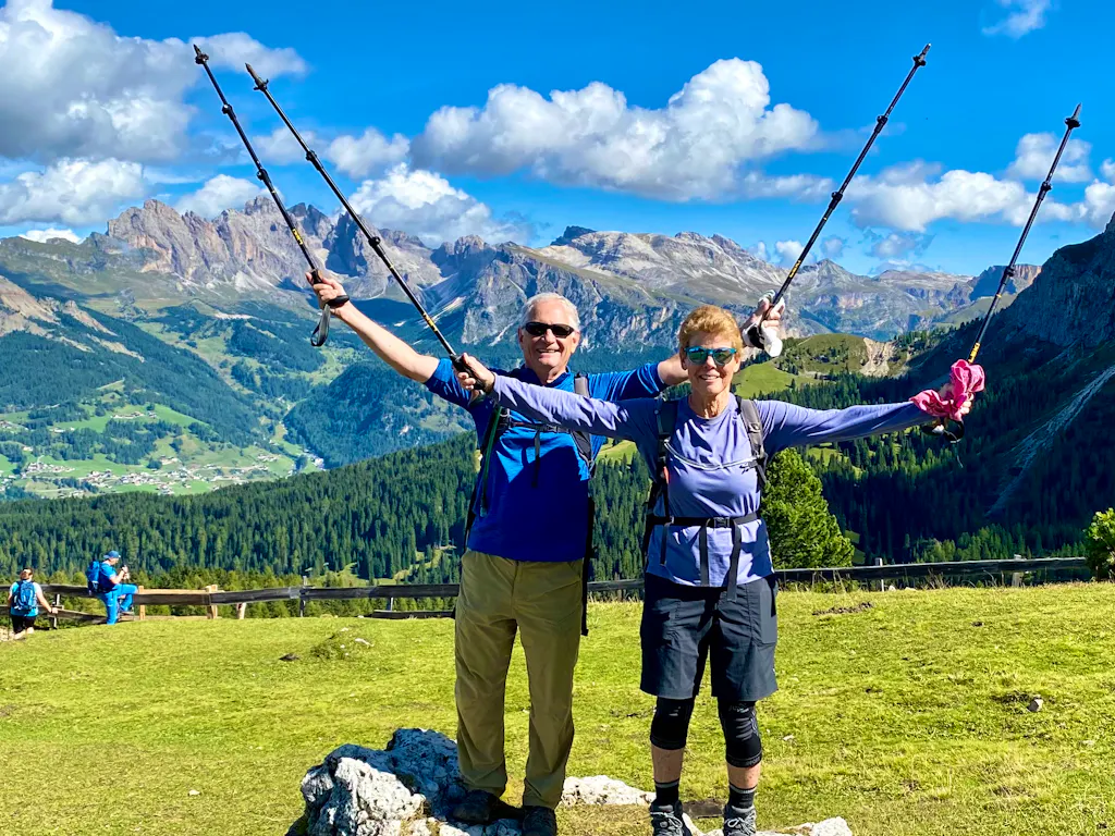 two hikers hiking the Dolomites on a best of Dolomites tour in Alps Region, Europe