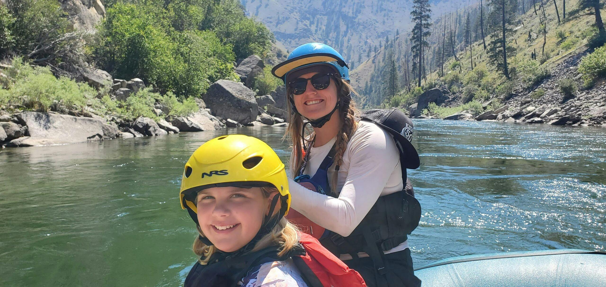 Guide and child rafting on the Middle Fork of the Salmon River in Idaho with MT Sobek