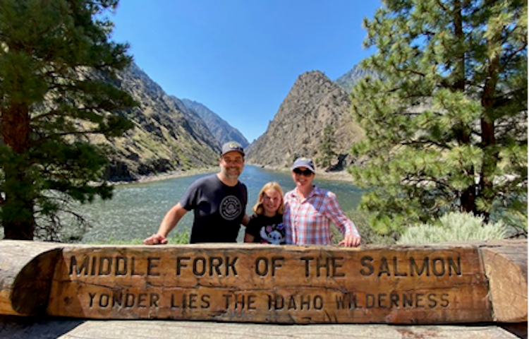 adventurous family with child enjoying white water rafting in Idaho's legendary Middle Fork of the Salmon River in North America