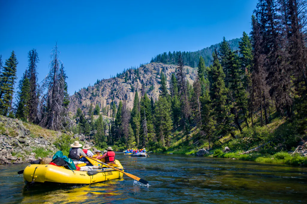 family rafting on a floatable kayak in the Middle Fork of the Salmon River in the summertime
