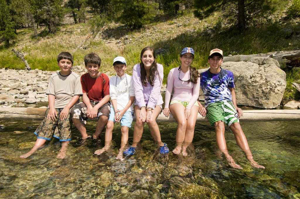 Children at a hot spring on the Middle Fork of the Salmon River with MT Sobek