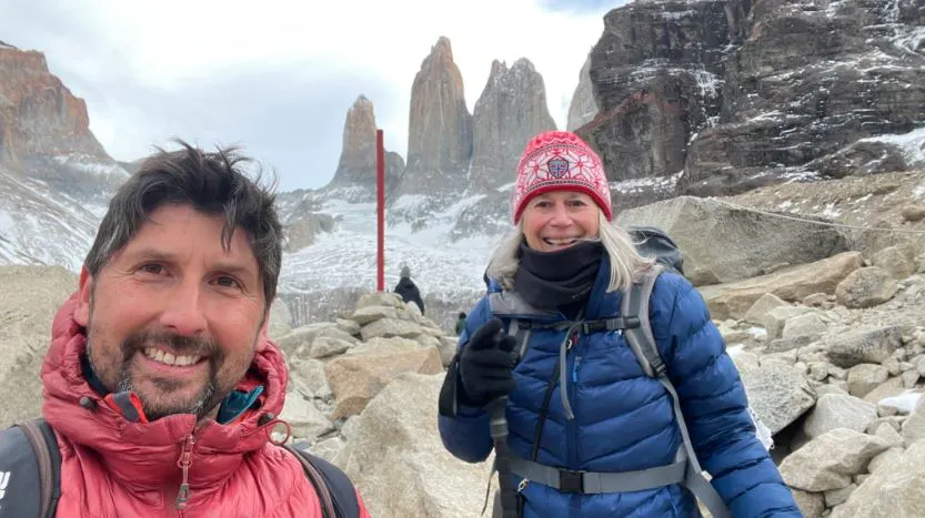 Diane arriving at Torres del Paine with guide in Patagonia Ultimate Challenge trek