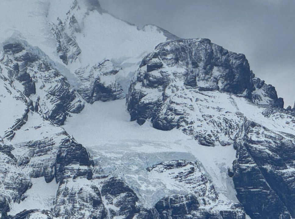 Diane traveling to Patagonia in the midst of snowy capped mountains