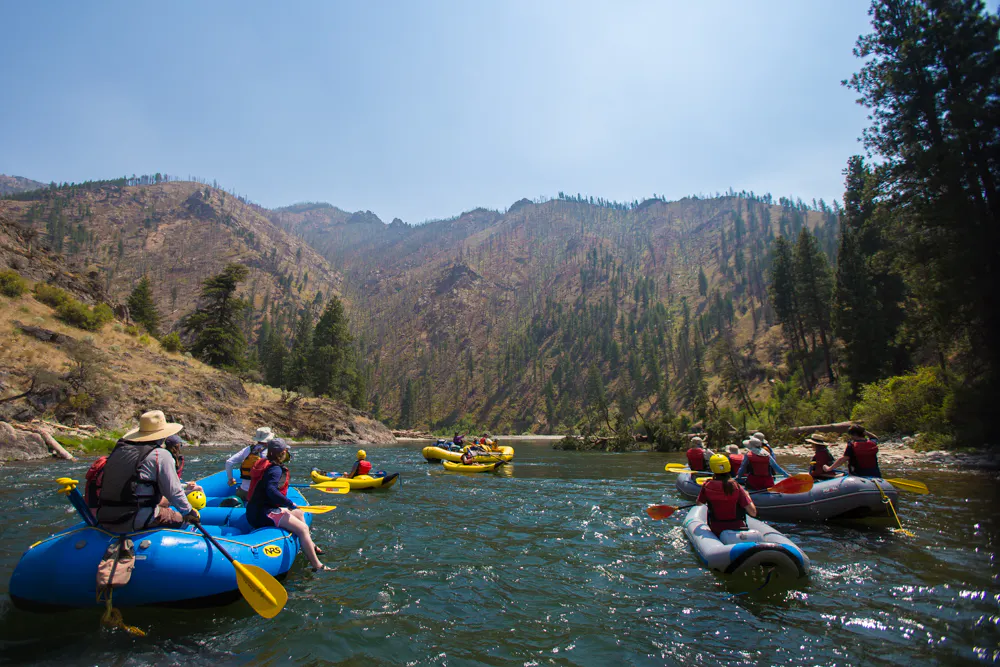 rafting on floatable kayaks and rafts with rafting poles in a summertime adventure to the Middle Fork in Idaho