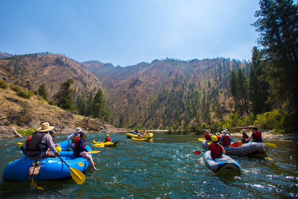 rafting on floatable kayaks and rafts with rafting poles in a summertime adventure to the Middle Fork in Idaho