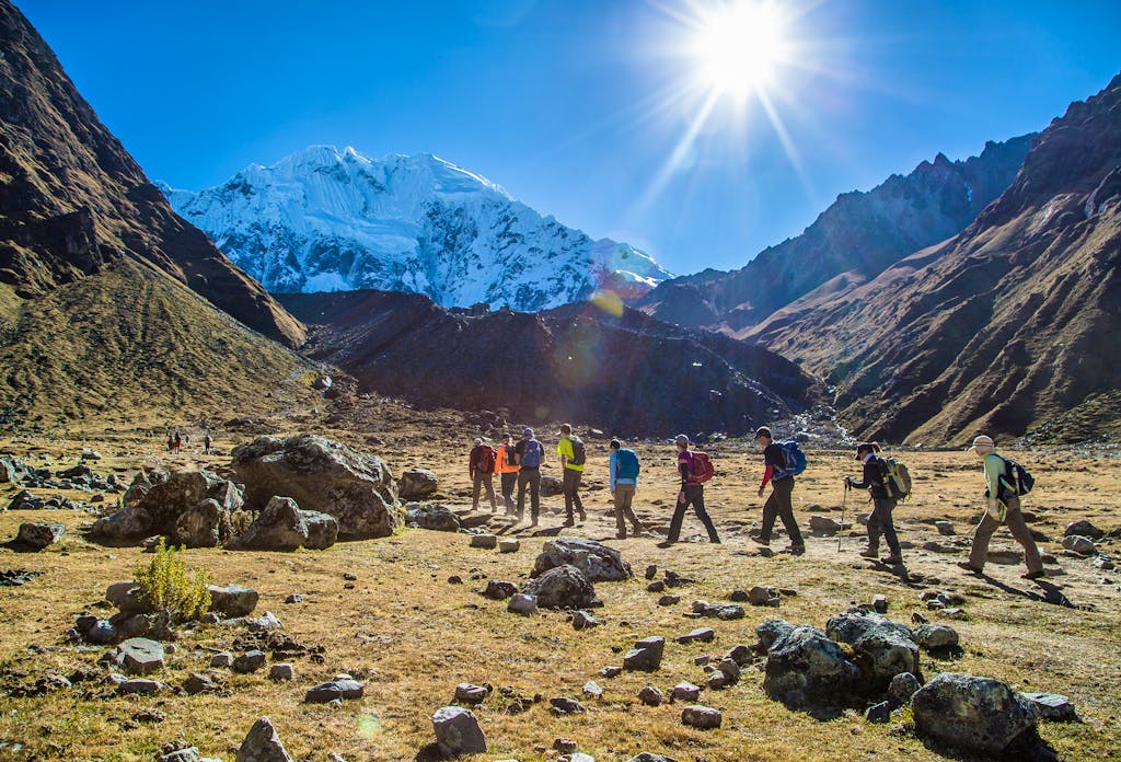 group of hikers hiking in the rugged wilderness of the Andes on a lodge-to-lodge trek to Machu Picchu on the Salkantay in the summer