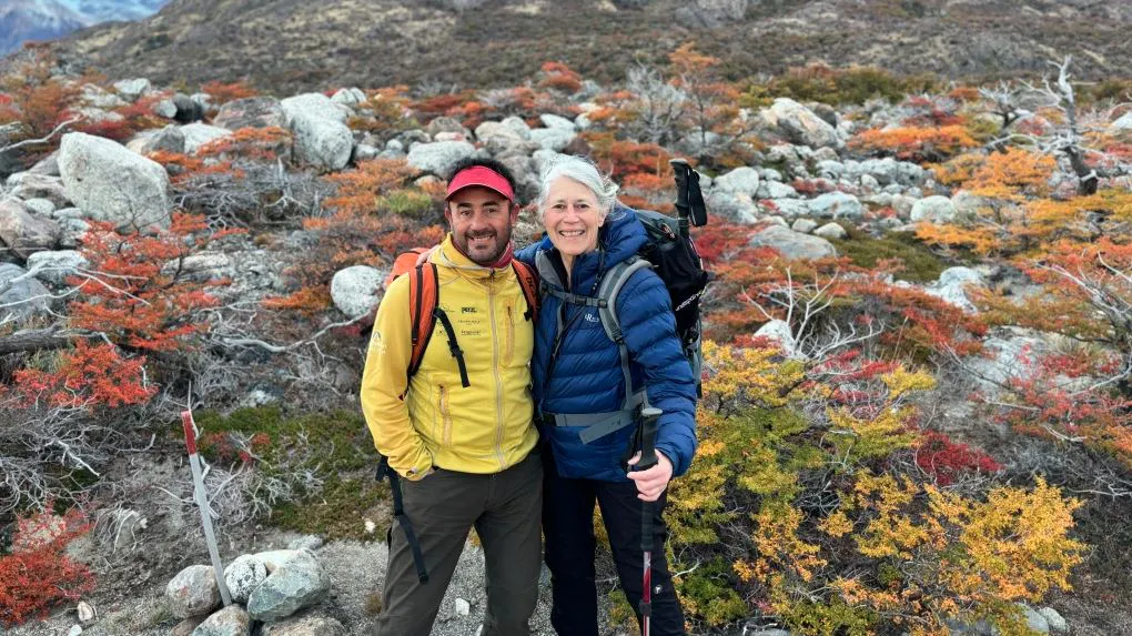 male guide with traveler walking to cousin peaks of Fitz Roy, Saint Exupery, and Poincenot in Argentina