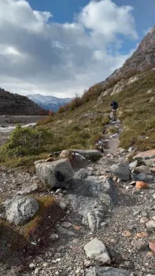 solo traveler on rugged terrain during hiking trip to Argentina