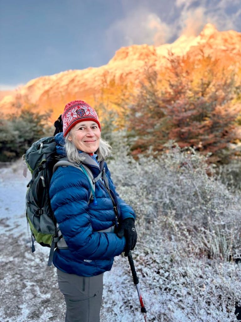 Diane the traveler with a red beanie and layers in Argentina in the fall