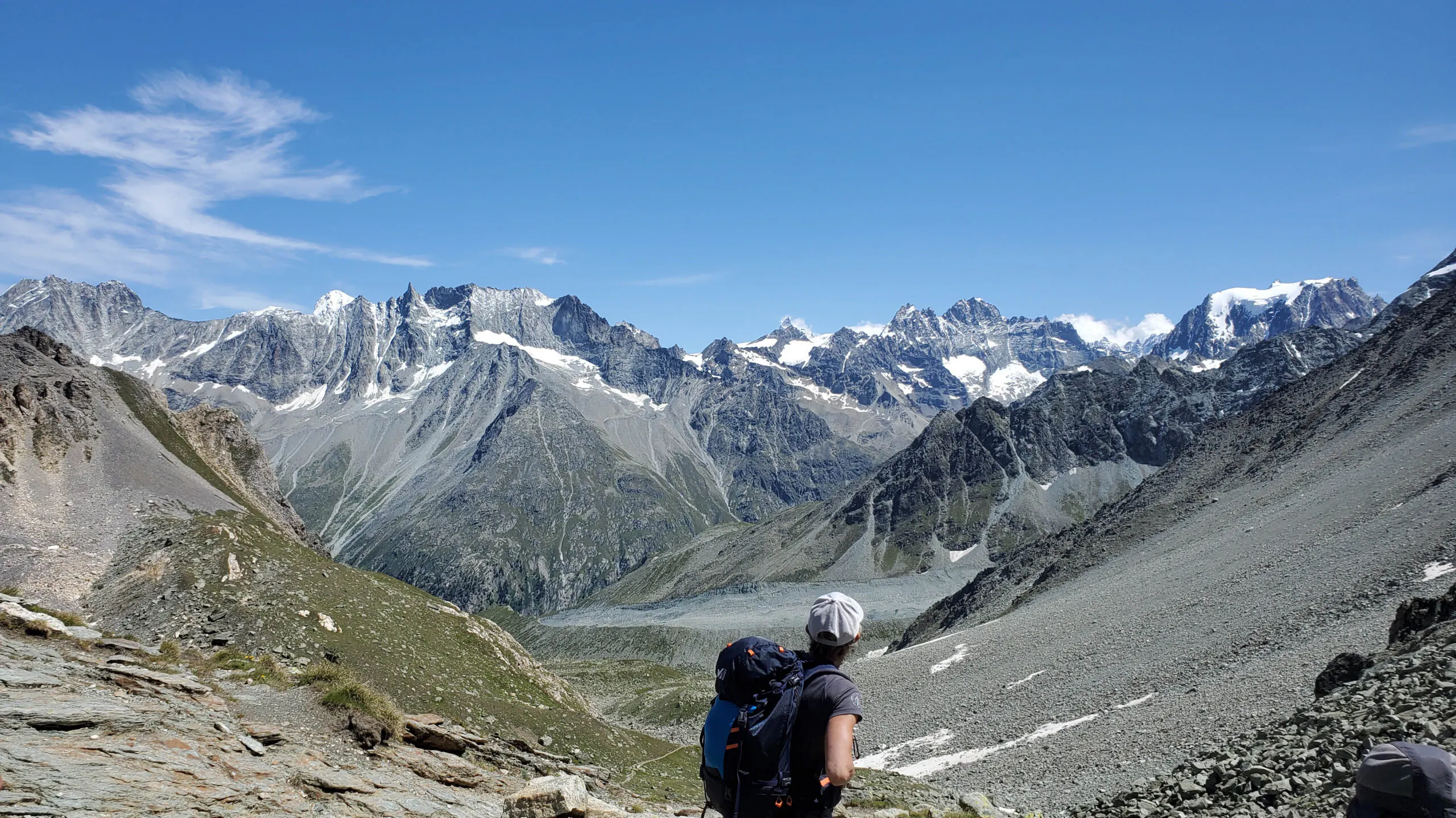 solo traveler hiking large mountain ascent in Alps region in Europe