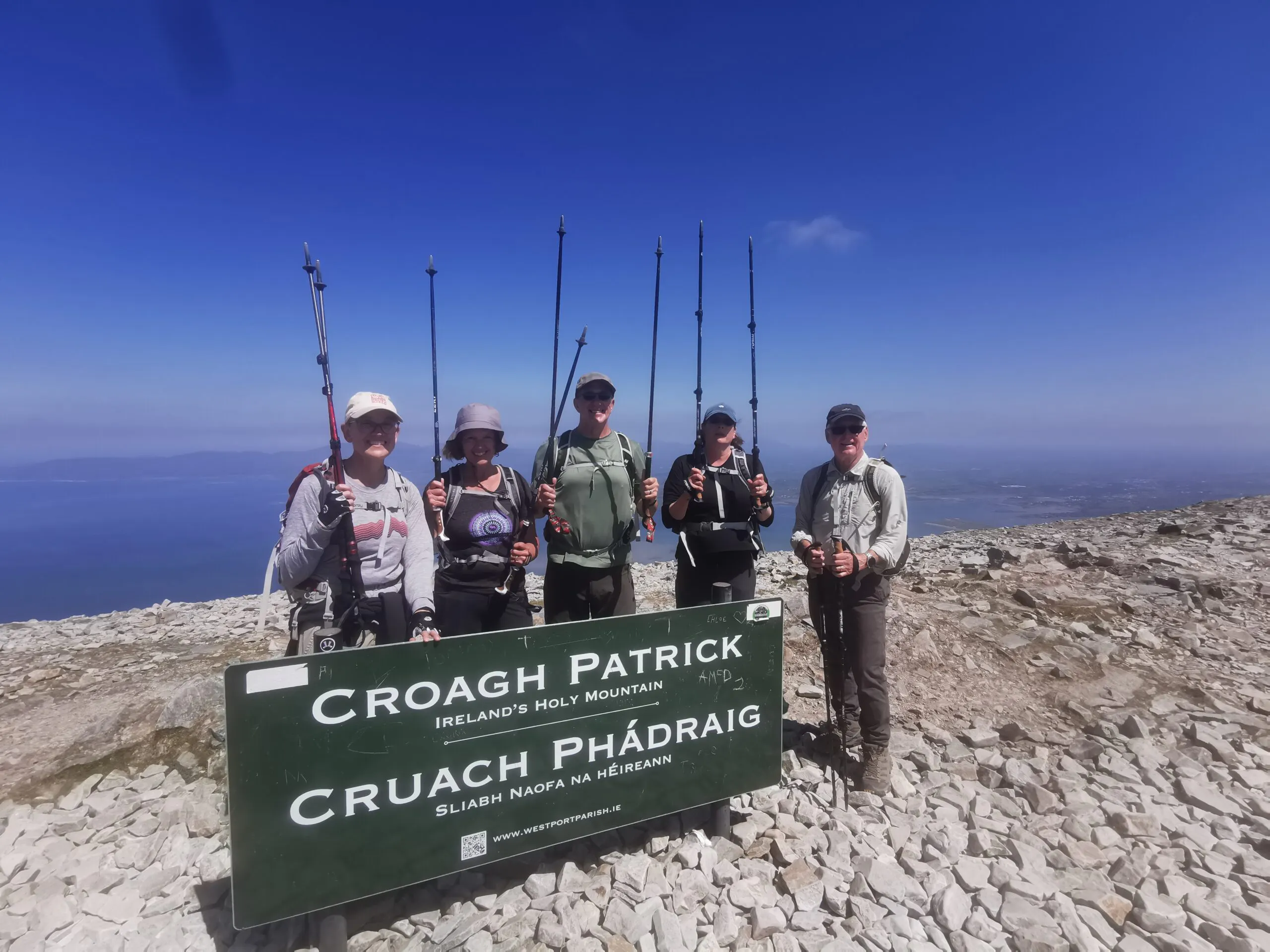 ascending a pilgrim trail to Croagh Patrick with hikers in Ireland, Europe