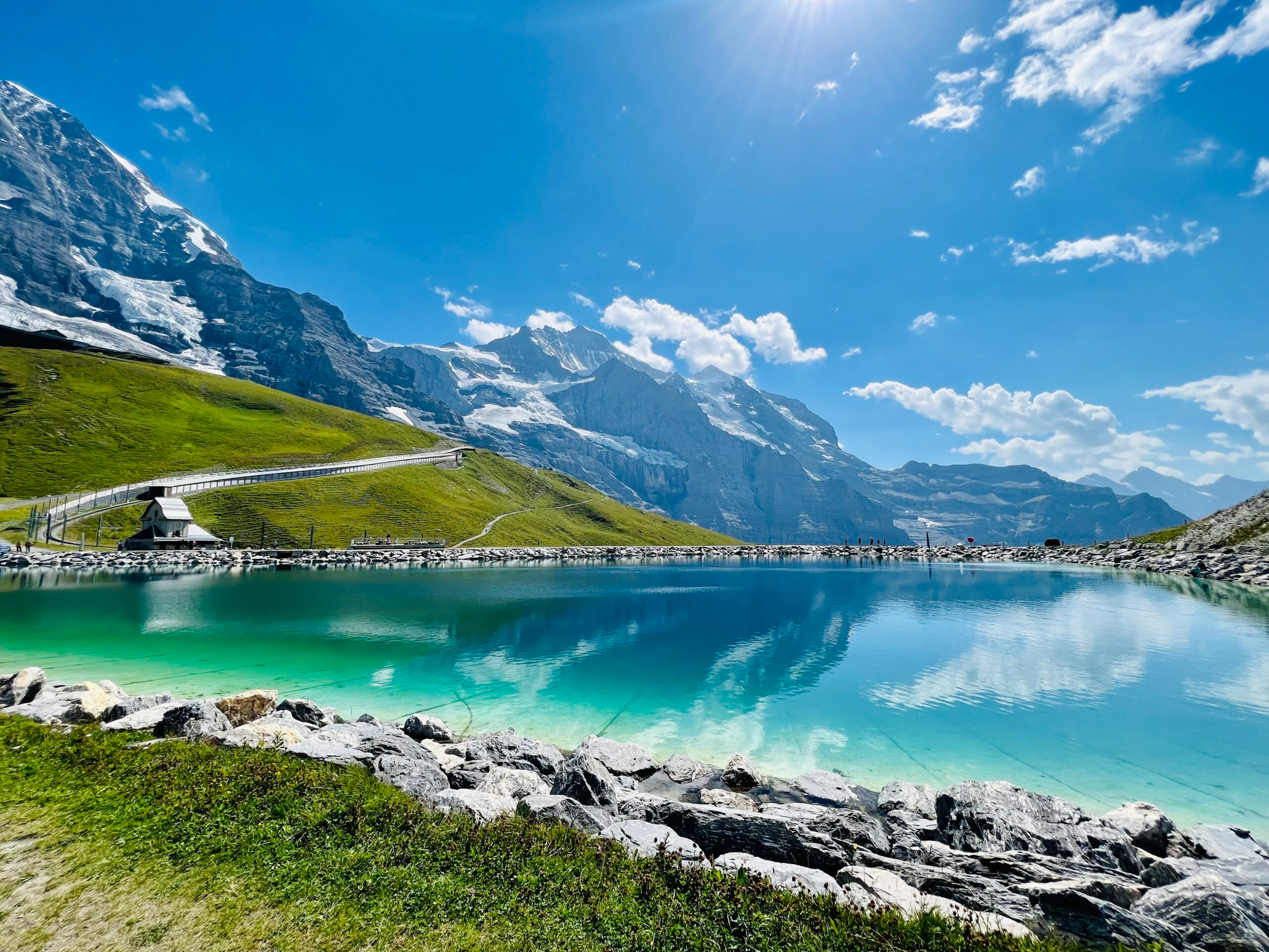 hiking village to village near alpine hamlets and mountain lodges in the Alps in Europe
