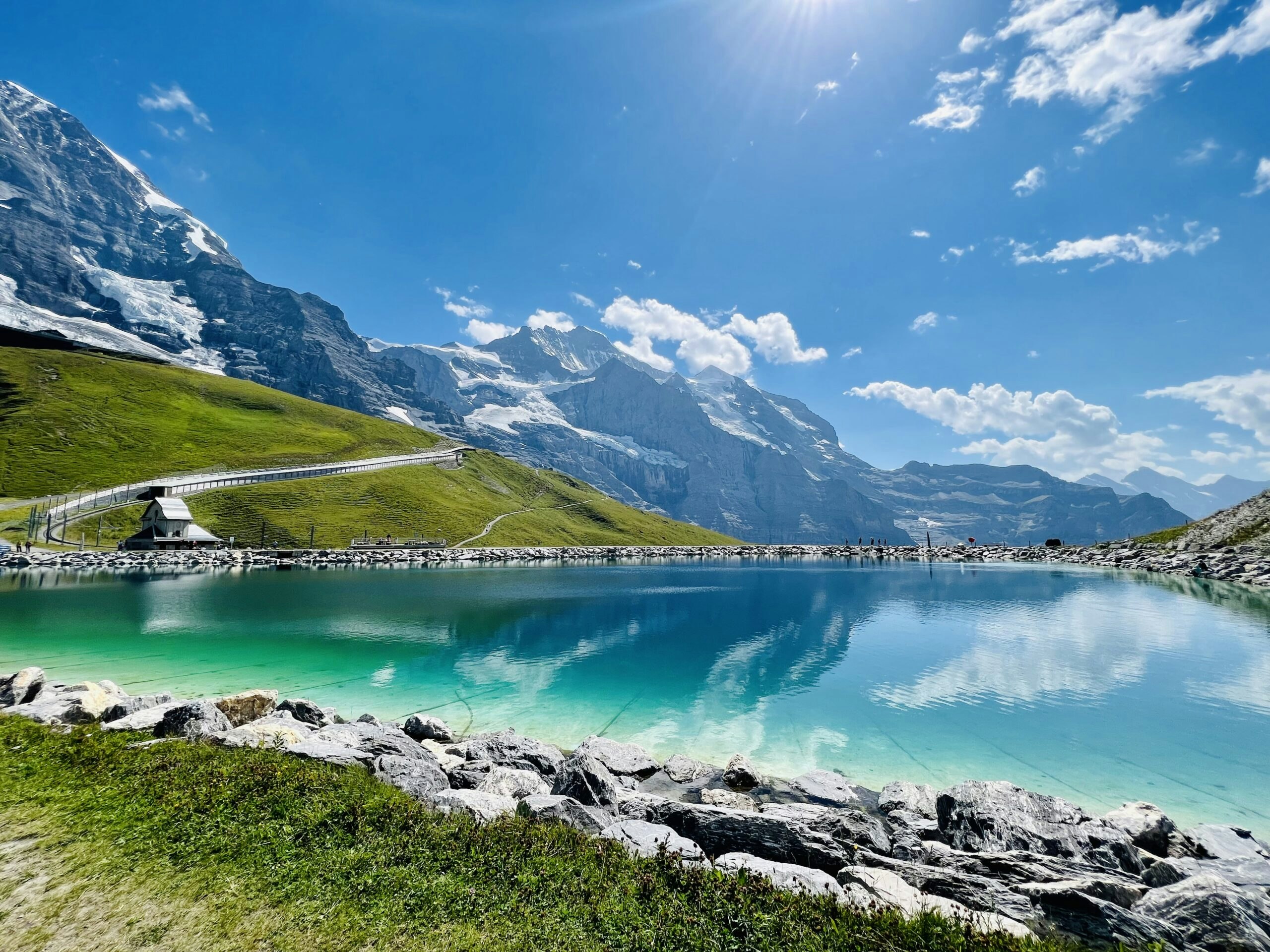 hiking village to village near alpine hamlets and mountain lodges in the Alps in Europe