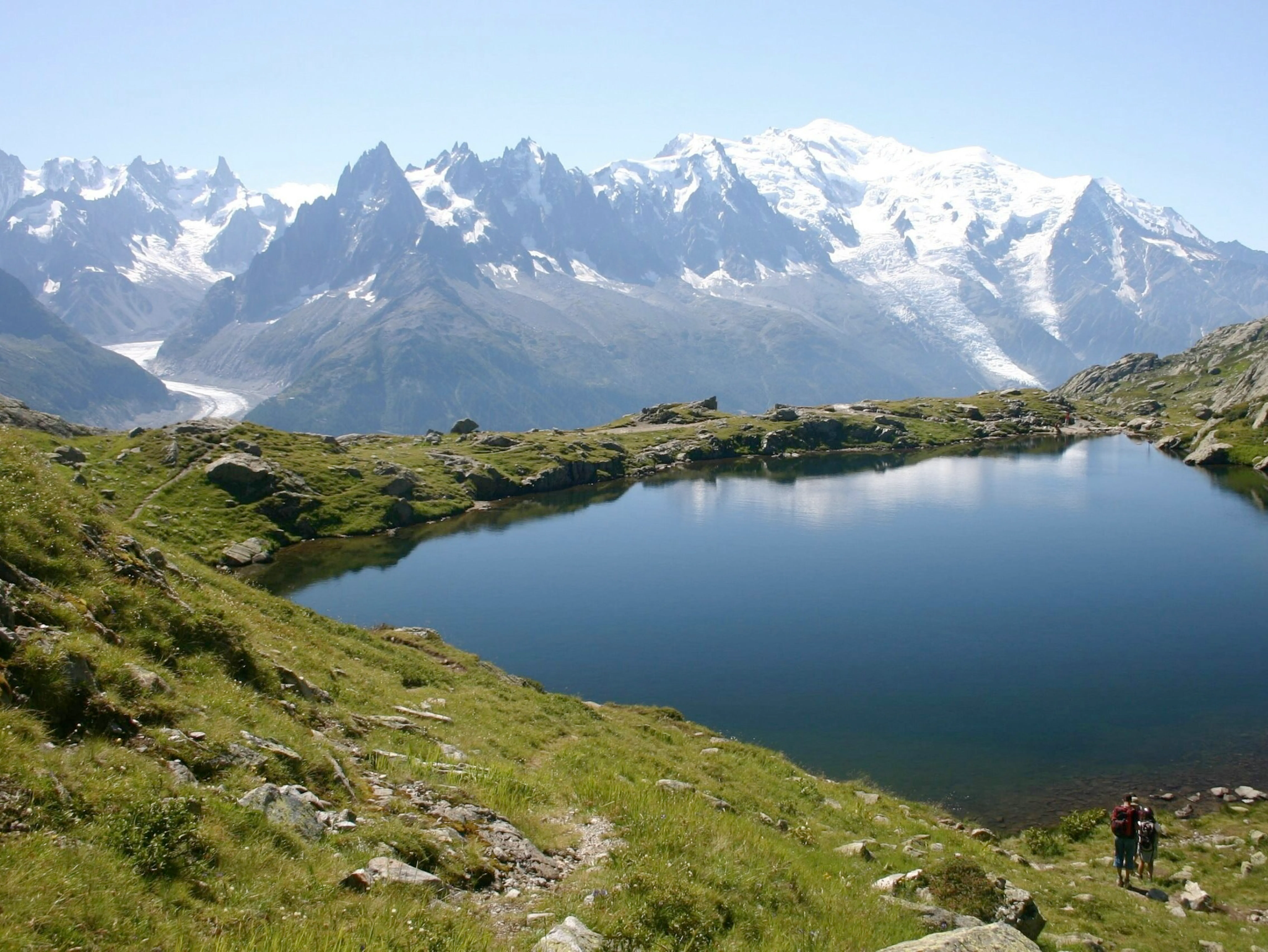 hiking scenic trails with group and guide in hiking circuit trail of Tour du Mont Blanc in the summer