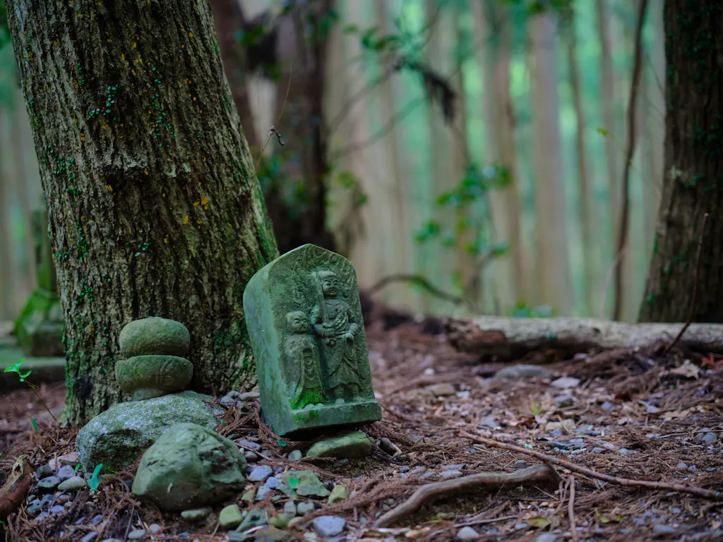 old stone statues in Kumano Kodo ancient trail in Japan