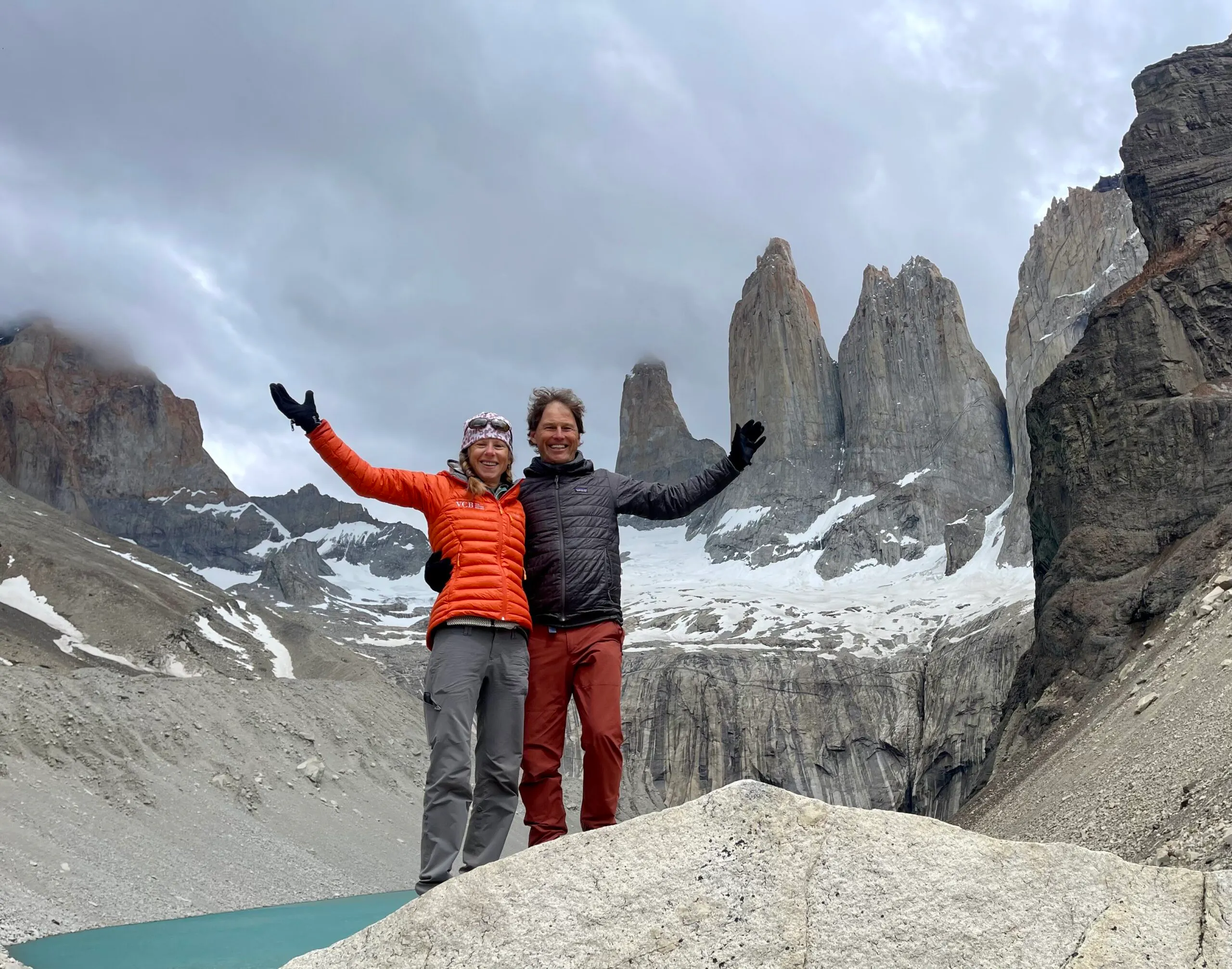 guests posing at base of towers in patagonia