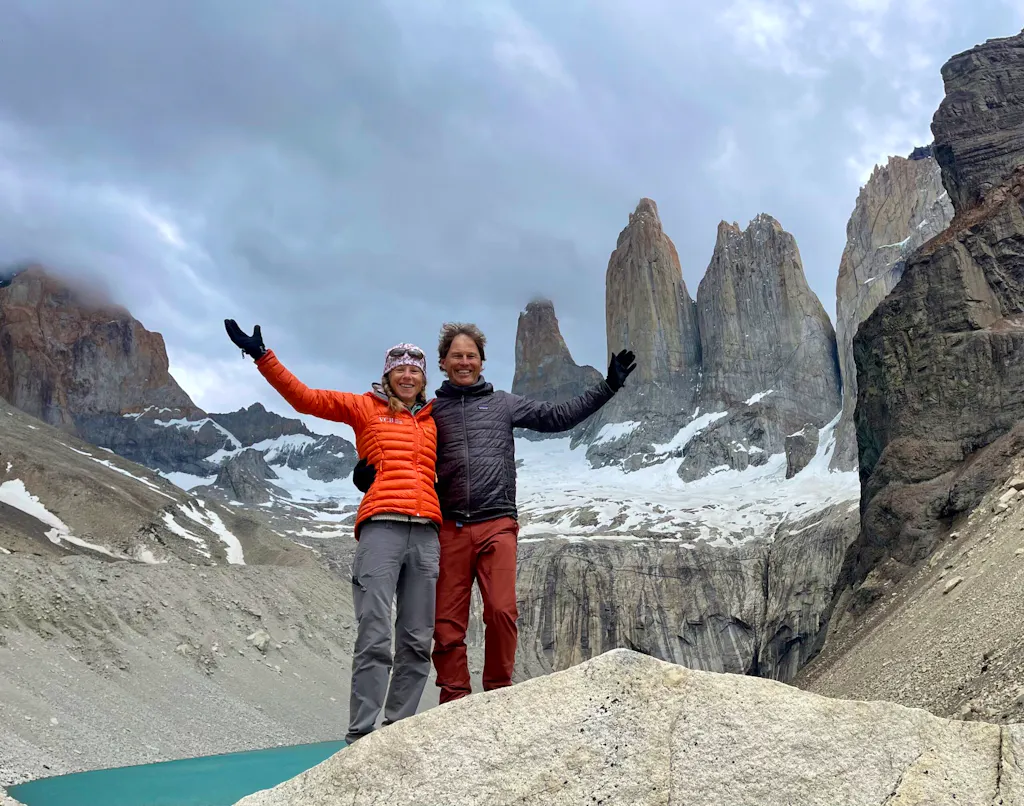 guests posing at base of towers in patagonia