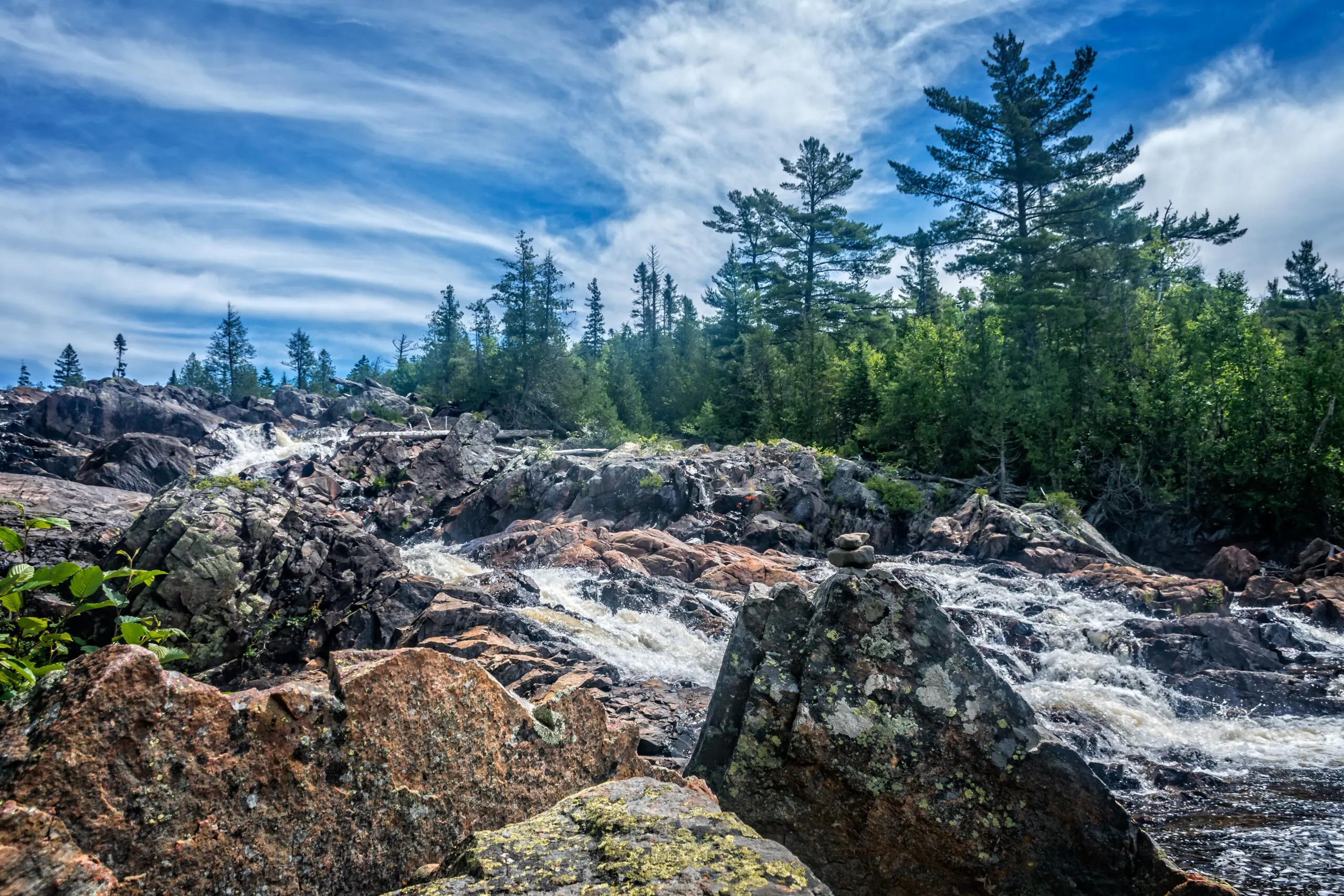 Cascading waterfall in Northern Canada with gorgeous Boreal Forests