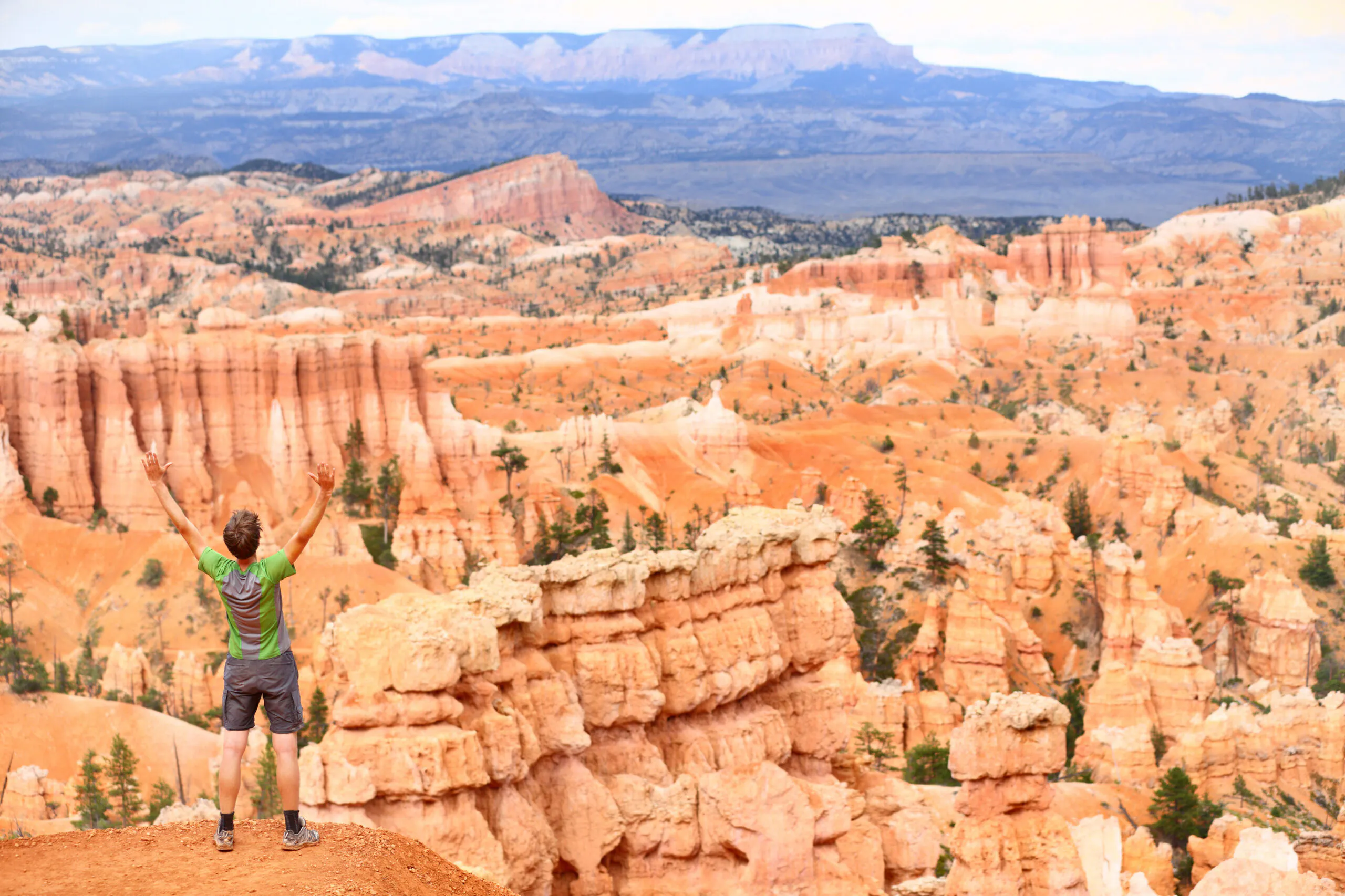happy hiker on fairyland point trail in bryce canyon