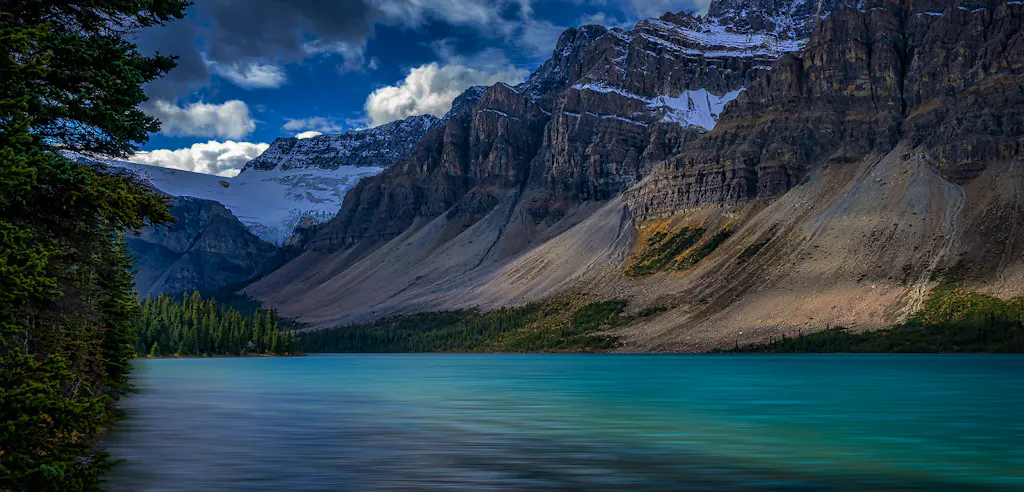 Stunning alpine lake in the Canadian Rockies with glaciers and mountains