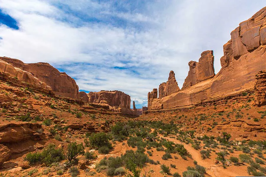 View of a hiking trail in Arches National Park at the Parkway with sandstone cliffs