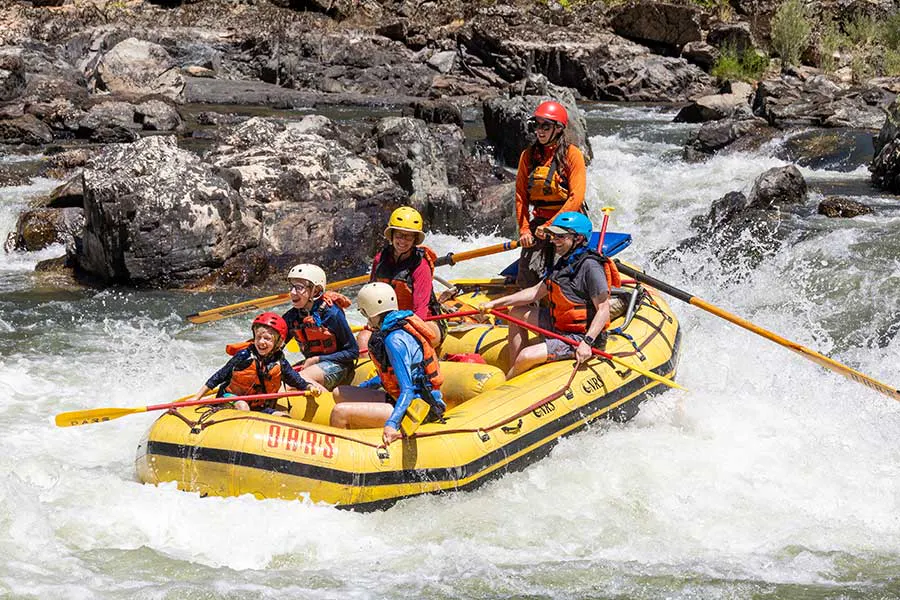 An OARS group having fun going through a rapid on the Rogue River, Oregon