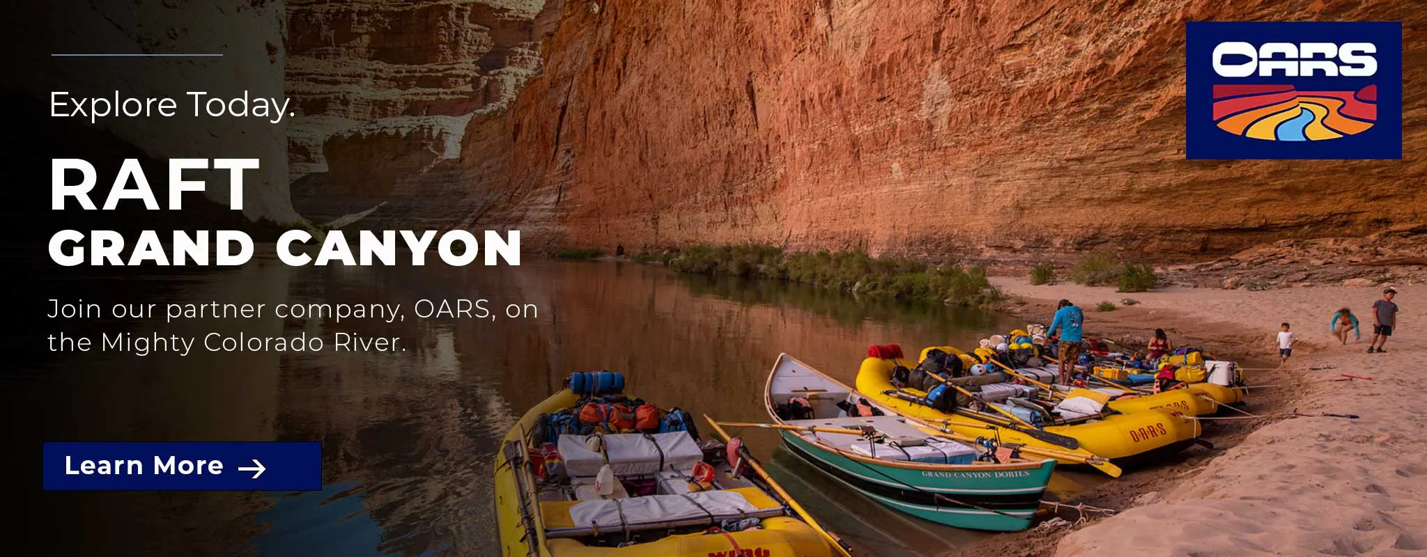 Several yellow rafts with gear are beached on a sandy shore beside steep canyon walls along the Colorado River, where people are preparing for a rafting trip after enjoying one of the best Phantom Ranch hiking tours that showcase the beauty of Grand Canyon hiking.