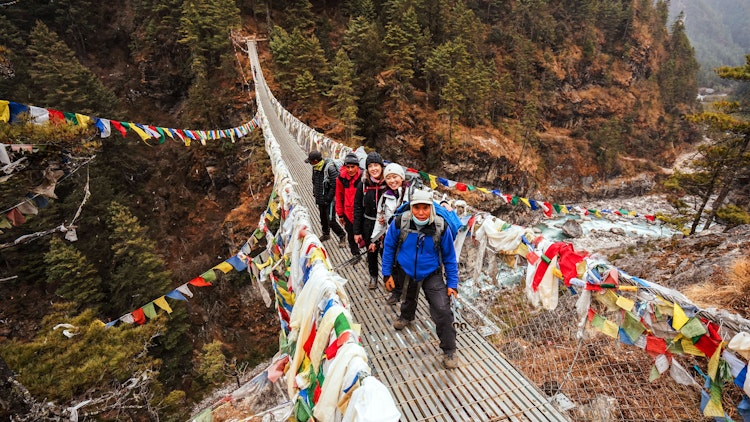 trekkers on bridge - Nepal Everest Base Camp Trek